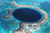 The Great Blue Hole Belize ; Abyss formed by a geological collapse, 480 feet deep and 1000 feet wide. It is a world-renowned scuba diving site.<br>Location: Lighthouse Reef, Belize.