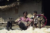 Young woman spinning wool Chitwan NP Nepal