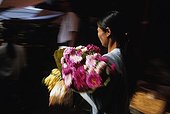 Woman holding a pink flowers bouquet Burma