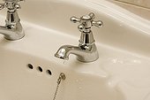 Water taps dripping in the bath-tub United Kingdom