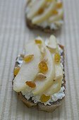 Slice of bread with goat's milk cheese and the pear France