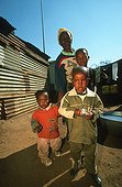 Mother and children in informal settlement area Johannesburg