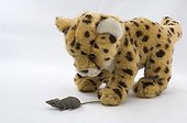 Stuffed Cheetah playing with a plastic mouse 