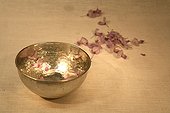 Gilt bowl and flower petals for the bath