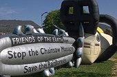 Inflatable chain saw to protest against deforestation