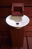Wash hand made up of a basin and a tap out of wooden