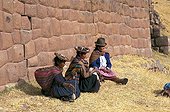 Women in traditional clothe spinning wool Peru