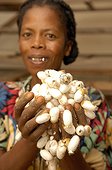 Woman and cocoons of scalded silkmoths Madagascar