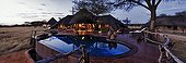 Luxury lodge and swimming pool at sunset Namibia