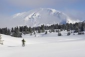Ski touring in the Vercors Isère France ; The Grand Veymont in the background. 