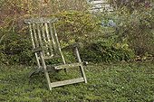Old wooden armchair at Jardin de Elsie in autumn