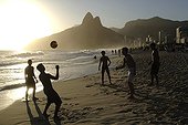 Football players on Ipanema beach Brazil