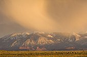 Snow storm at sunset over Arches National Park USA