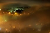 City of Annecy in the fog at night in winter