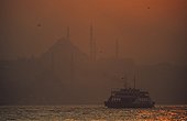 Crossing of Bosphorus by ferry at sunset Turkey 