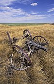 Farm machinery abandoned in a field Saskatchewan Canada