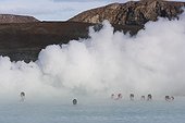 People in Spa in geothermal Blue Lagoon Iceland  ; The discharge of hot water from power plant are used for spa, a place is very popular in Iceland near Reykjavik.