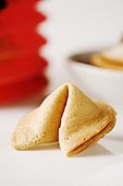 Fortune cookie and red Chinese lantern in background