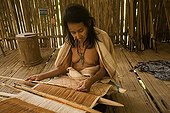 Native woman weaving Manu National Park Peru