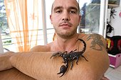 Man owner playing with his Scorpion