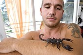 Man owner playing with his Scorpion