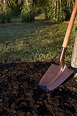 Shovel and prepared ground in a garden Provence France