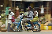 Transport person motorcycle Ouidah in Benin  ; Universal means of transport at the Zem Benin, abbreviation of Zémidjan, which literally means "take me away fast" or "take me quickly" in Fon, the language of southern Benin. 