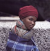 Ndebele woman showing traditional neck banded beadwork