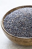 Poppy seeds in a wooden bowl