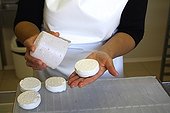 Removing of fresh goat cheese France 