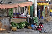 Children doing their laundry outside a shop Madagascar