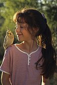 Girl with Cockatiel elegant on the shoulder 