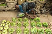 Dealer preparing his market stall Kerala India