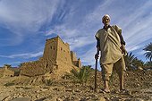 Farmer and Ksar at Draa Valley in Morocco ; To the south of Ouarzazate is located the Draa Valley, an oasis 200 km bordered by fields and palm Ksour built of adobe