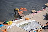 Man washing clothes in the Ganges Varanasi India