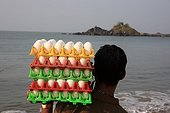 Seller of eggs on the beach Gokarna India