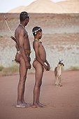 Farther and son San with caracal n background Namibia ; In the private reserve named "N/a’an ku sê", welfare programs and health support converge to maintain populations of Bushmen in good health and to reintroduce the wild Cheetahs. This nomadic group of hunter-gatherers has a history dating back over 20,000 years. Their close relationship and perfect their knowledge of animals allowed to live and feed in the deserts of southern Africa.