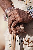 Close-up of the hands of an elderly San woman Namibia ; In the private reserve named "N/a’an ku sê", welfare programs and health support converge to maintain populations of Bushmen in good health and to reintroduce the wild Cheetahs. This nomadic group of hunter-gatherers has a history dating back over 20,000 years. Their close relationship and perfect their knowledge of animals allowed to live and feed in the deserts of southern Africa.