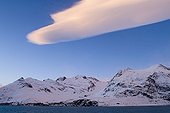 South Georgia ; Mountains bordering Gold Harbour and Lenticular cloud South Georgia November