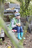 Boy eating apple sauce