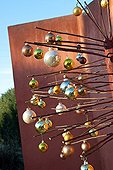 Artificial Christmas tree with balls on a garden terrace