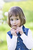 Girl blowing a whistle is a breakthrough Nuts  ; Girl aged 5 years