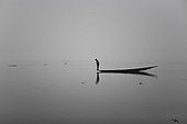Fishing boat in fog on Inle Lake in Burma