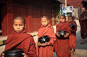 Young monks doing the quest with their bowl in Burma