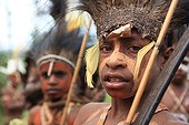 Boy with cap and sweet potato Papua New-Guinea ; Traditional dance Framini school called singsing 