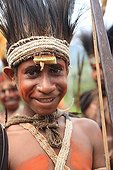 Boy with feather headdress and bow Papua New-Guinea ; Traditional dance Framini school called singsing 