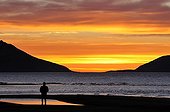 People at sunset Carlsberg Fjord Greenland 