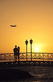 Couple on a bridge at sunset Aruba Dutch Caribbean