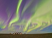 Northern Lights over houses Iceland