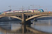Interregional train crossing a bridge over the Loire Nantes